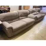 Two matching contemporary four-seater settees with grey/brown upholstery, length 200cm, depth