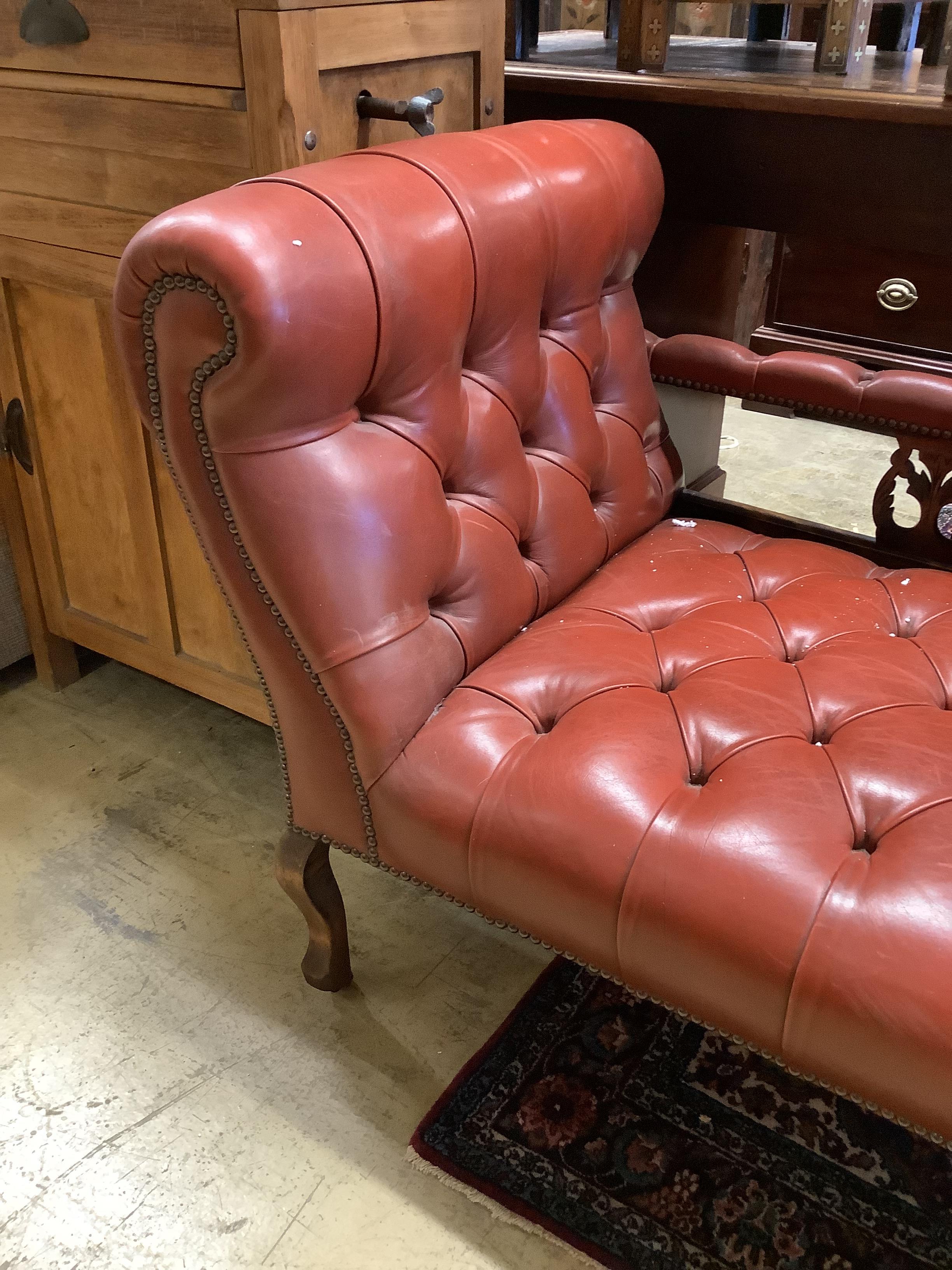 An Edwardian beech two-seater couch upholstered in buttoned burgundy hide on scrolled legs, length - Image 2 of 3