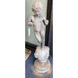 A Victorian lead garden ornament of a putto on orb, height 80cm