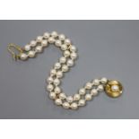 A modern double strand cultured pearl bracelet with a 9ct and cultured pearl clasp, 18cm,gross 17.5