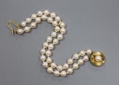 A modern double strand cultured pearl bracelet with a 9ct and cultured pearl clasp, 18cm,gross 17.5