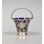 A late Victorian pierced pale-shaped small sugar basket, with cobalt glass liner, William Henry