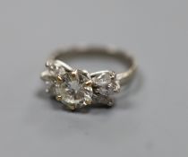 A white metal (stamped 18ct Plat) and single stone diamond ring, with six stone marquise cut