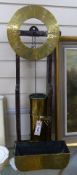 A 17th century style oak and brass 'Clepsydra' or water clock,having engraved chapter ring, water