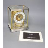 A Jaeger le Coultre Atmos mantel clock, in silvered and gilt metal glazed panelled case, height