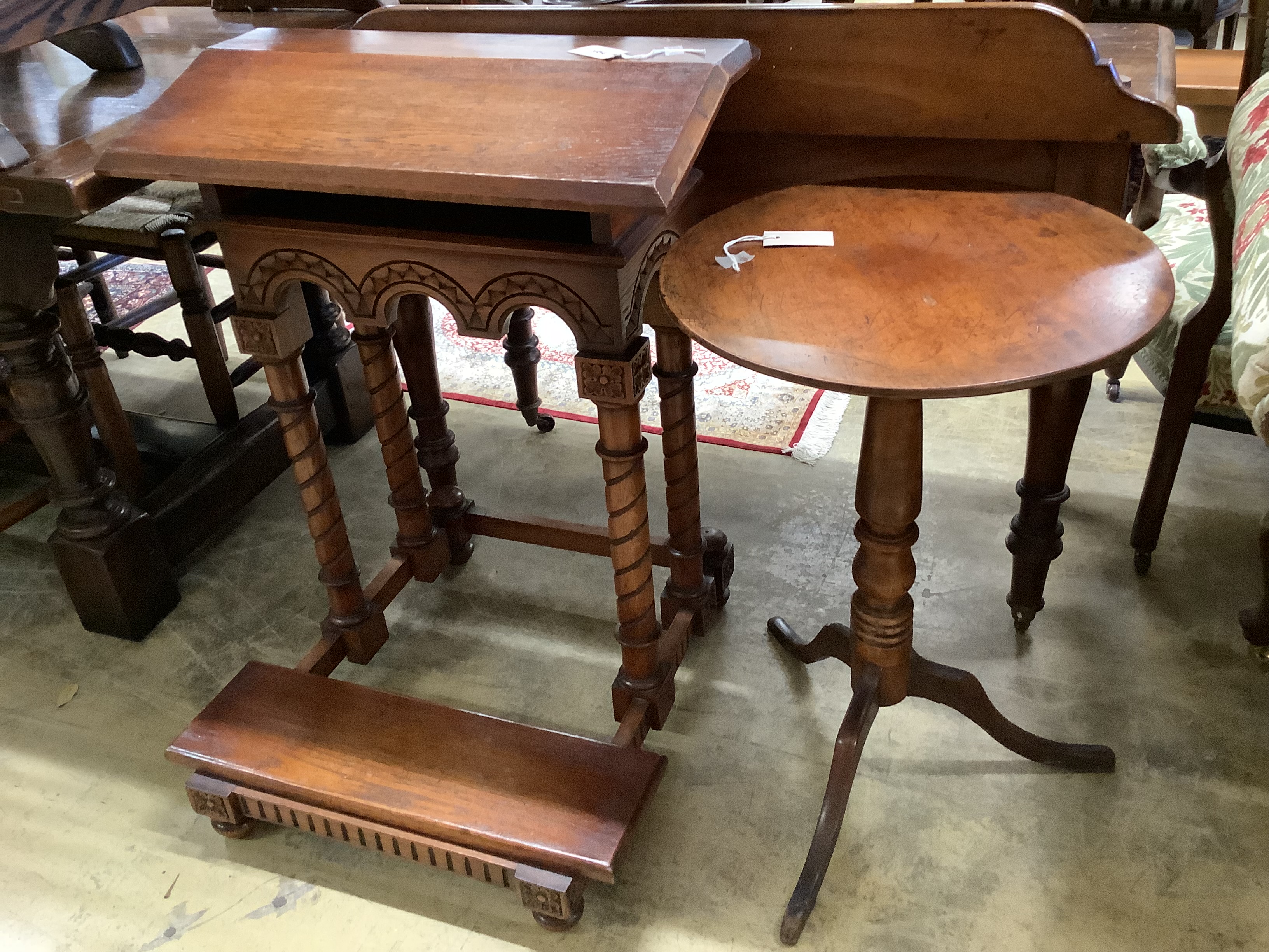 A Gothic style carved oak prie-dieu, width 64cm, height 82cm together with a 19th century circular