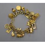 A 9ct curb link charm bracelet hung with twenty one assorted mainly 9ct gold charms,gross 55.8