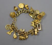 A 9ct curb link charm bracelet hung with twenty one assorted mainly 9ct gold charms,gross 55.8