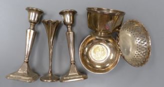 A pair of George V silver mounted candlesticks, 15.2cm, a silver posy vase, silver bowl, silver