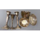 A pair of George V silver mounted candlesticks, 15.2cm, a silver posy vase, silver bowl, silver