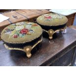A pair of Victorian floral tapestry circular carved giltwood footstools, length 36cm, height 20cm