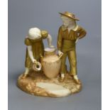 A Royal Worcester group of a boy and a girl, date code for 1917, height 24cm