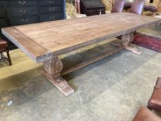 An 18th century style rectangular pine refectory dining table, length 300cm, depth 100cm