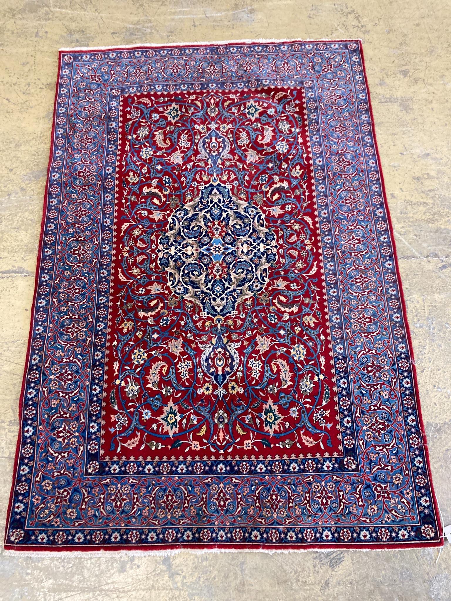 An Isfahan red ground rug, 169 x 110cm