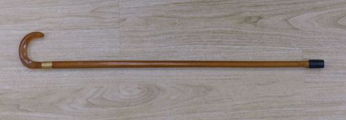 Art Art Deco walking stick with amber-coloured Bakelite handle and 18ct gold band, length 81cm