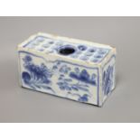 An 18th century Delft ware flower brick, length 12.5cm