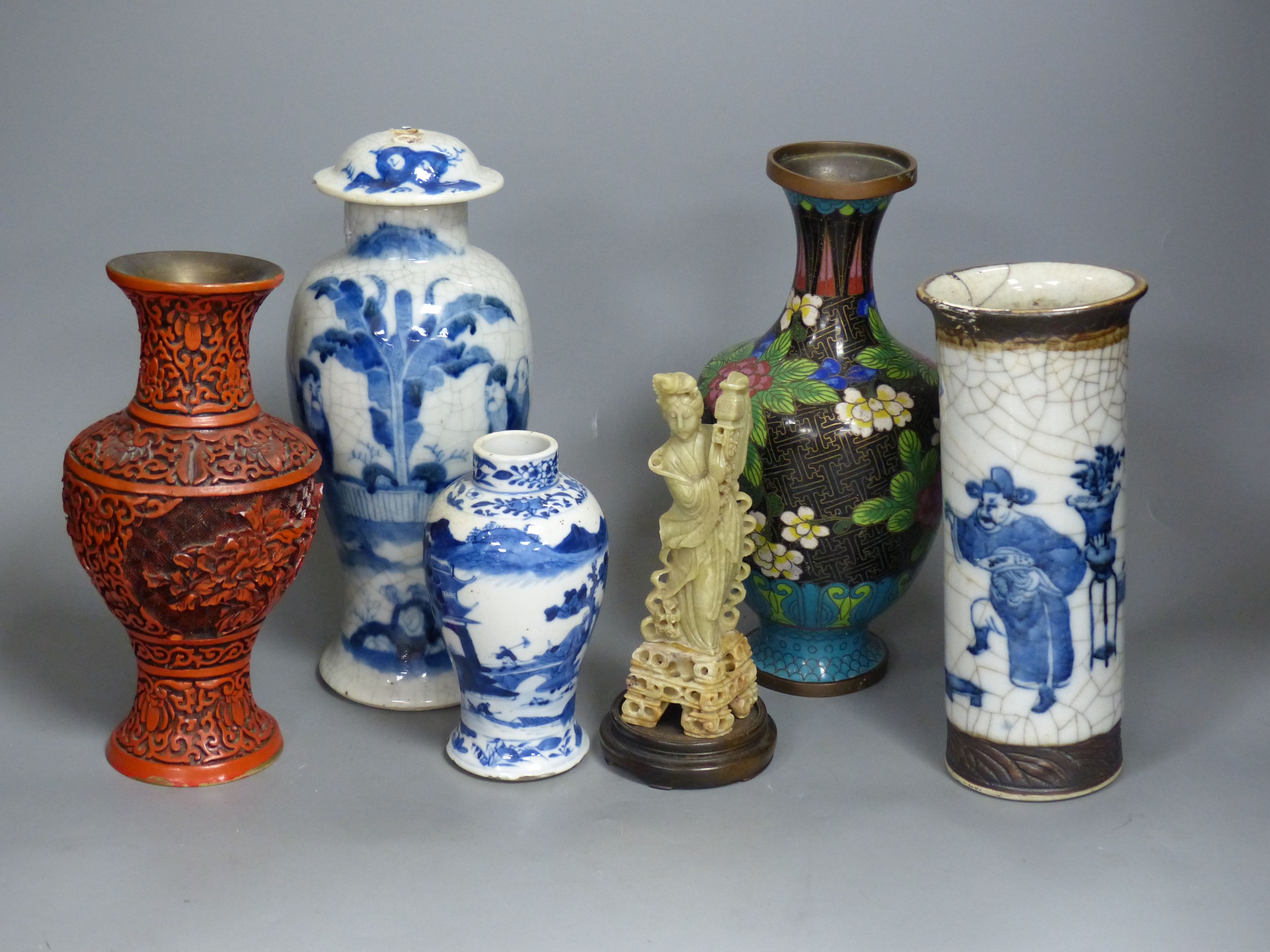 Three Chinese blue and white vases, a cloisonne enamel vase, another vase and a soapstone figure