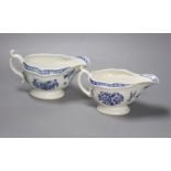 Two Worcester strap fluted floral sauceboats, c.1770, with scratch cross mark and crescent mark and