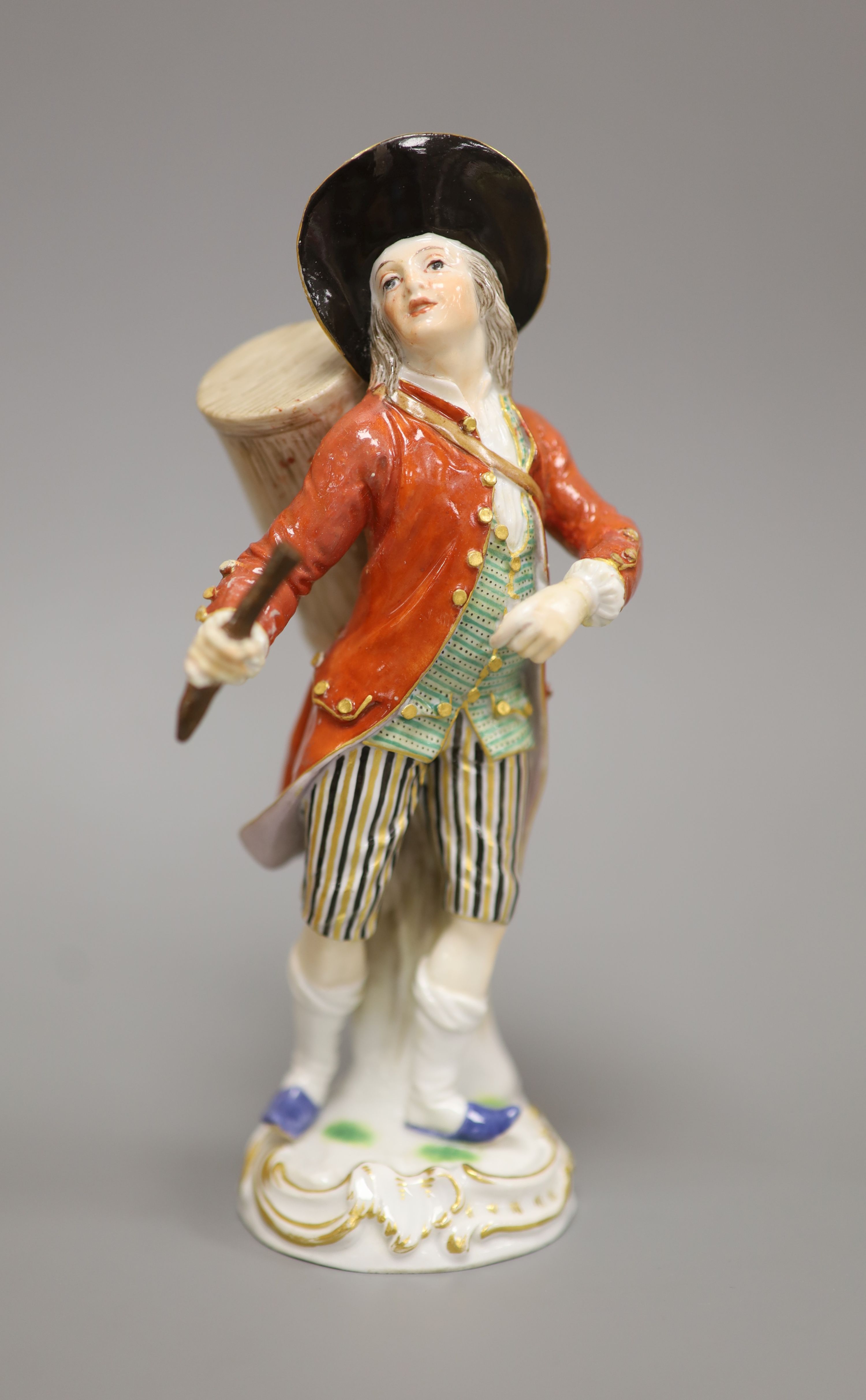 A late Meissen porcelain figure of a drummer boy, polychrome-decorated on scrolled base, height