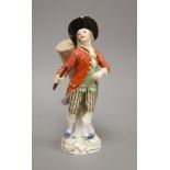 A late Meissen porcelain figure of a drummer boy, polychrome-decorated on scrolled base, height