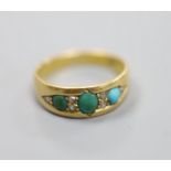 An early 20th century 18ct, three stone turquoise and six stone diamond chip set ring, size M/N,