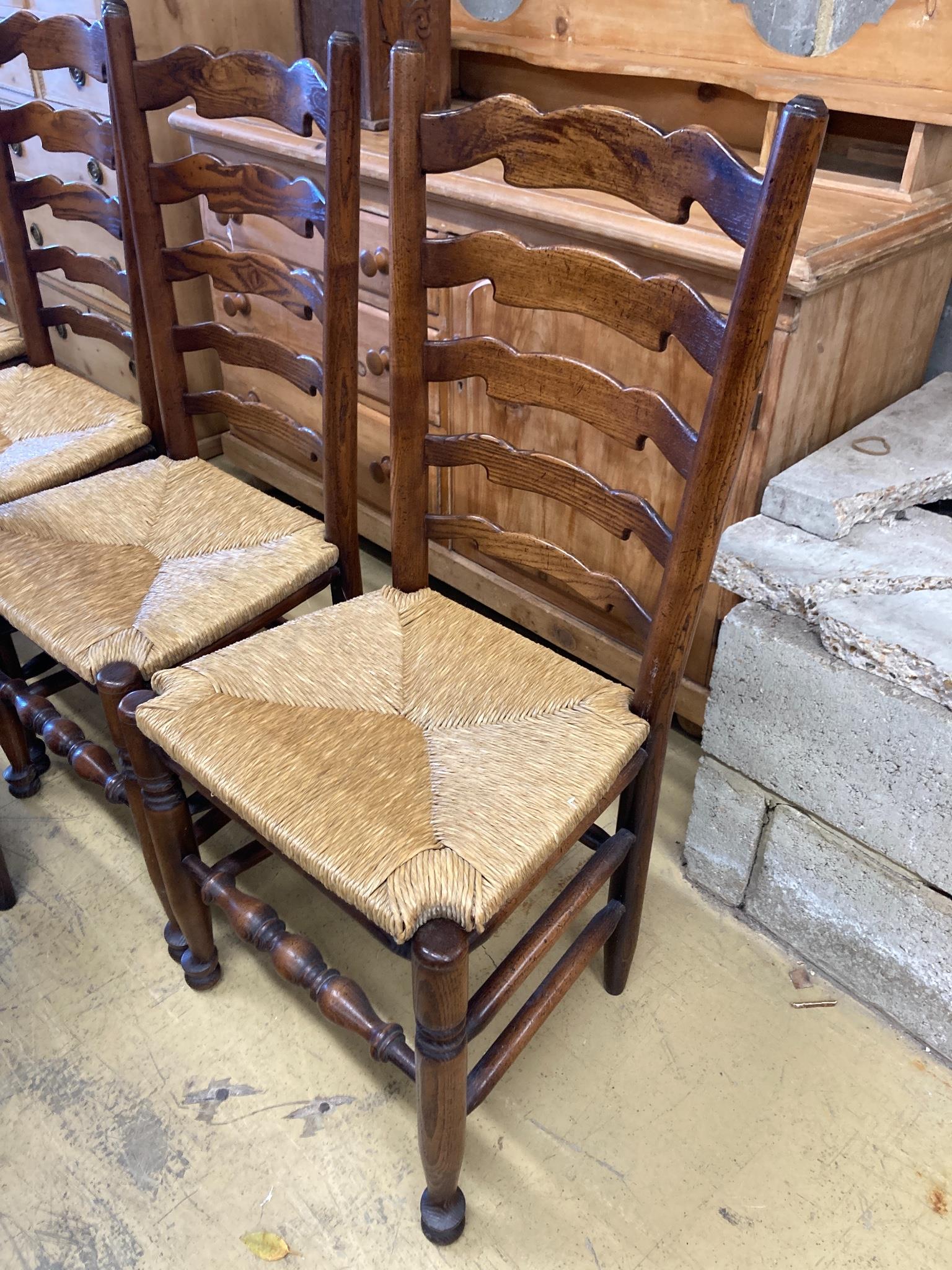 A set of five Lancashire ash and beech rush-seat ladderback chairs (one with arms) - Image 3 of 3