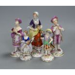 A German porcelain figure of a masked harlequin with stringed instrument and four other Continental