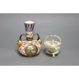 A Royal Crown Derby vase, with two mask head handles painted in Imari style, date code for 1882 and