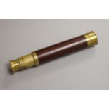 An early 20th century brass and mahogany three drawer telescope, overall length 40.5cm extended