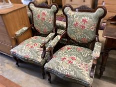 A pair of late Victorian mahogany upholstered armchairs