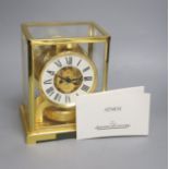 A Jaeger le Coultre Atmos mantel clock, with white enamelled Roman chapter ring, in gilt-brass