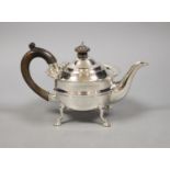 An Edwardian silver three piece tea set, comprising teapot, sugar basin and cream jug, Charles
