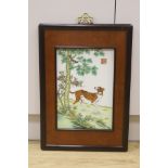 A Chinese porcelain plaque of a dog after Castiglione, 36 x 24cm, framed,