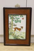 A Chinese porcelain plaque of a dog after Castiglione, 36 x 24cm, framed,