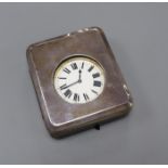 A George V silver mounted travelling watch case, with an incomplete nickel cased pocket watch, 11.