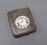 A George V silver mounted travelling watch case, with an incomplete nickel cased pocket watch, 11.