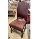 A set of six French leather high back dining chairs