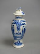 A late 19th century Chinese blue and white crackle glaze vase and cover, height 27cm