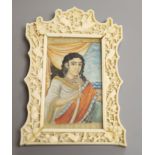 An Indian miniature gouache on ivory in a Chinese Ivory frame, circa 1900of a figure smoking a