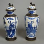 A pair of Chinese blue and white crackle glaze vases and covers, early 20th century, height 22cm