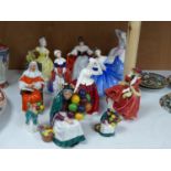 Ten Royal Doulton figurines, including 'Sara', 'The Judge', 'The Old Balloon Seller', 'Elaine' and