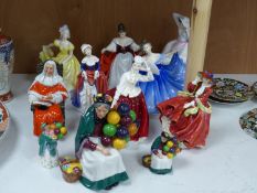 Ten Royal Doulton figurines, including 'Sara', 'The Judge', 'The Old Balloon Seller', 'Elaine' and