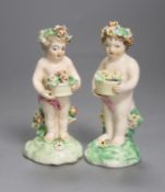 A good pair of Derby figures of children holding baskets of flowers c. 1760, patch marks, firing