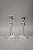 A pair of late Victorian silver oval candlesticks, with engraved inscription, Charles Stuart Harris