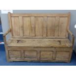 An 18th century pine settle, length 157cm, depth 51cm, height 116cm