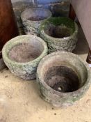 A set of four circular reconstituted stone garden planters, diameter 29cm, height 23cm