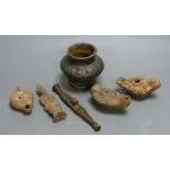 A group of antiquities, three oil lamps, a vase and a figure, etc.