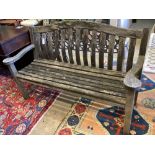 A weathered teak garden bench, length 155cm, depth 57cm, height 98cm