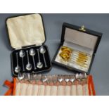 A set of twelve Christofle forks, a cased set of English coffee spoons and a set of Solingen gold-