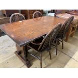 A 17th century style oak 'refectory' table on shaped trestle end supports, length 160cm, depth